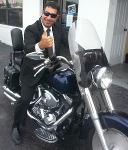 Project Lift's President, RJ Ferraro, checking out the 2000 Harley donated by Victory Auto Sales