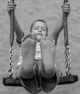 kid swinging