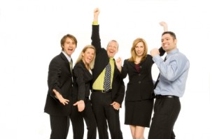 Five business people gesture excitement together