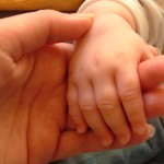 child hand in adult hand